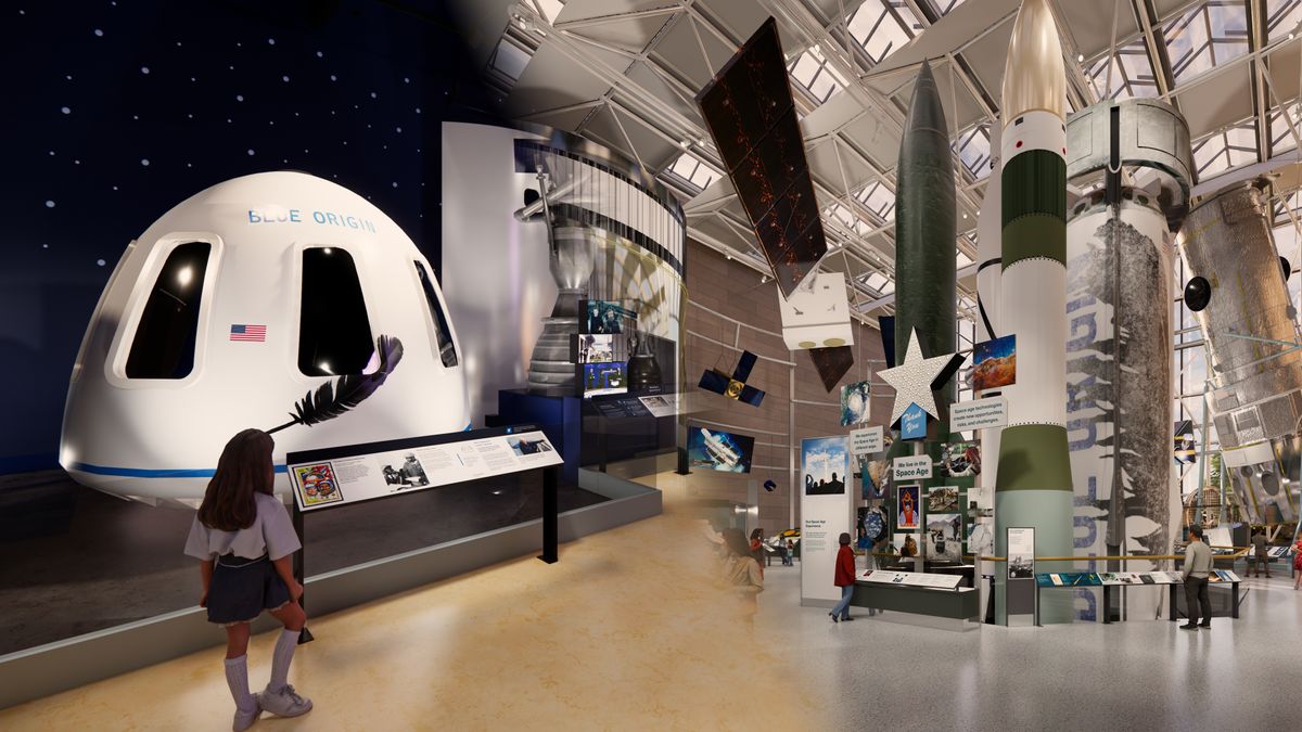 a white space capsule sits in a large museum hall, surrounded by other space artifacts