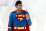 Superman, played by American actor Christopher Reeve (1952 - 2004), holds a green crystal at the Fortress of Solitude, in a promotional still from 'Superman', directed by Richard Donner, 1978