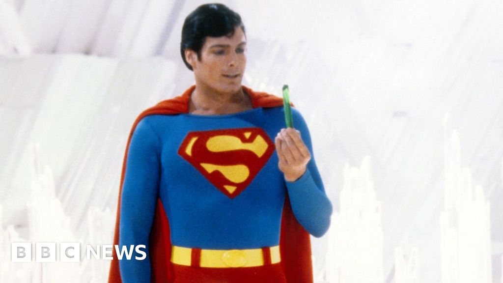 Superman, played by American actor Christopher Reeve (1952 - 2004), holds a green crystal at the Fortress of Solitude, in a promotional still from 'Superman', directed by Richard Donner, 1978