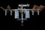 a space station hangs in black